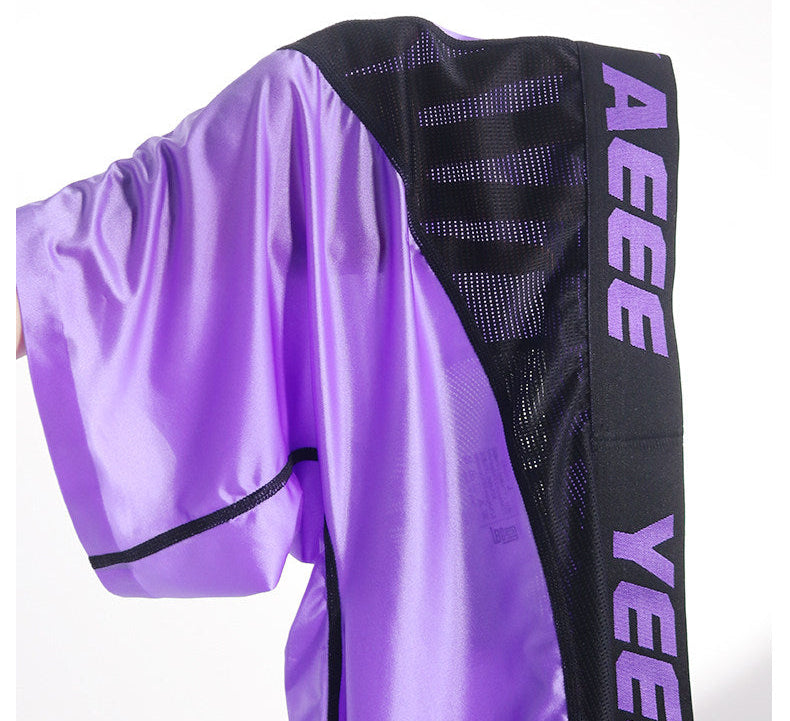Purple athletic outfit with 'YEE' branding on a white background