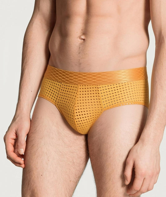 Yellow men's underwear on a plain background